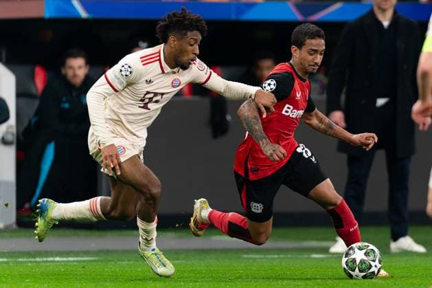 2025-03-11 Bayer 04 Leverkusen v FC Bayern Munchen - UEFA Champions League 2024 25 Round of 16 Second Leg LEVERKUSEN, GERMANY - MARCH 11: Kingsley Coman of FC Bayern Munchen battles for the ball with Arthur of Bayer 04 Leverkusen during the UEFA Champions League 2024 25 Round of 16 Second Leg match between Bayer 04 Leverkusen and FC Bayern Munchen at BayArena on March 11, 2025 in Leverkusen, Germany. Leverkusen BayArena Germany Content not available for redistribution in The Netherlands directly or indirectly through any third parties. Copyright: xJorisxVerwijstx