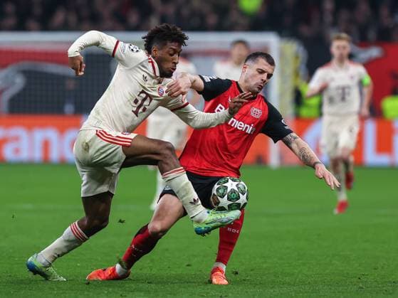 March 11, 2025, Leverkusen, Nrw, Germany: GRANIT XHAKA (Bayer 04 Leverkusen, 34) and KINGSLEY COMAN (Bayern MoÂ¼nchen, 11) fights for ball, during the UEFA Champions League round of 16, 2nd leg match between Bayer 04 Leverkusen and Bayern MoÂ¼nchen at the BayArena Stadium. Leverkusen Germany - ZUMAb275 20250311_zsp_b275_024 Copyright: xGabrielxBoiax