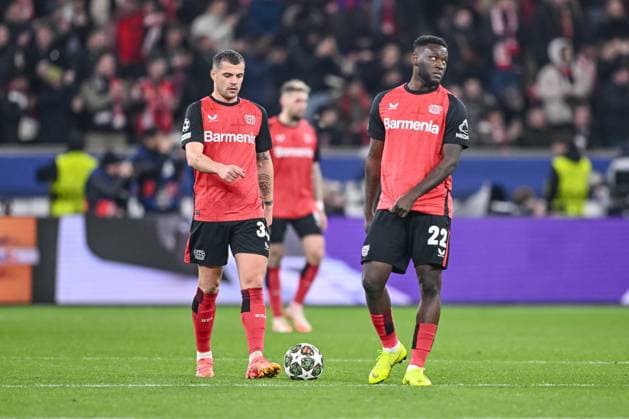 Leverkusen, Germany, 11.03.2025: Granit Xhaka (Bayer 04 Leverkusen) und Victor Boniface (Bayer 04 Leverkusen) look dejected during the UEFA Champions League 2024 25 Round of 16 Second Leg match between Bayer 04 Leverkusen and FC Bayern München at BayArena on March 11, 2025 in Leverkusen, Germany. (Photo by Harry Langer DeFodi Images)