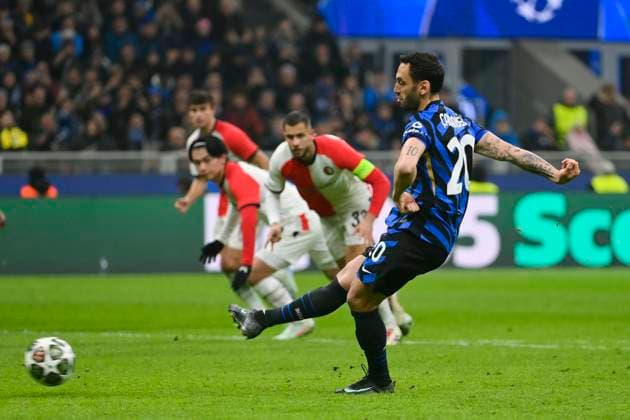 11th March 2025; Stadio San Siro, Milan, Italy, Champions League Football, Last 16, Second Leg, Inter Milan versus Feyenoord; Hakan Calhanoglu of FC Internazionale shoots and scores his goal from a penalty kick for 2-1 in the 51st minute  ActionPlus12759157 BestxImages