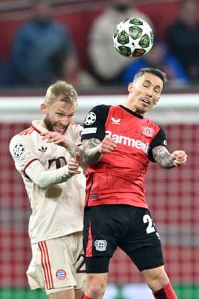 (250312) -- LEVERKUSEN, March 12, 2025 -- Alejandro Grimaldo (R) of Bayer 04 Leverkusen and Konrad Laimer of Bayern Munich head for the ball during the UEFA Champions League Round of 16 2nd leg football match between Bayer 04 Leverkusen and Bayern Munich in Leverkusen, Germany, March 11, 2025. (Photo by Xinhua) (SP)GERMANY-LEVERKUSEN-FOOTBALL-UEFA CHAMPIONS LEAGUE-LEVERKUSEN VS BAYERN MUNICH UlrichxHufnagel 