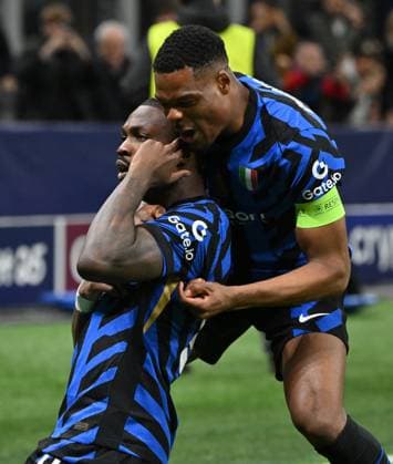(250312) -- MILAN, March 12, 2025 -- Inter Milan s Marcus Thuram (L) celebrates his goal with his teammate Denzel Dumfries during the round of 16 second leg match of UEFA Champions League between Inter Milan and Feyenoord in Milan, Italy, March 11, 2025. (Photo by Xinhua) (SP)ITALY-MILAN-FOOTBALL-UEFA CHAMPIONS LEAGUE-INTER MILAN VS FEYENOORD AlbertoxLingria 