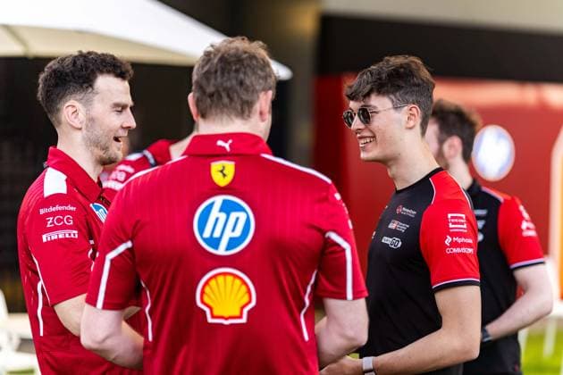 March 12, 2025, Melbourne, Victoria, Australia: MoneyGram Haas F1 Team driver OLIVER BEARMAN of the United Kingdom converses with members of the Scuderia Ferrari HP team on Wednesday at the Formula 1 Louis Vuitton Australian Grand Prix 2025 on March 12, 2025 in Melbourne, Australia. Melbourne Australia - ZUMAf186 20250312_zsp_f186_009 Copyright: xJamesxForresterx