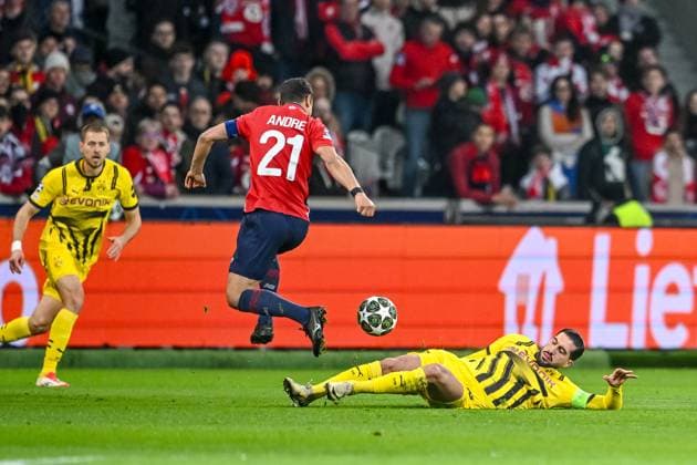 Lille, France, 12.03.2025: Benjamin Andre (LOSC Lille) und Emre Can (BV Borussia Dortmund) battle for the ball during the UEFA Champions League 2024 25 Round of 16 Second Leg match between LOSC Lille and Borussia Dortmund at Stade Pierre-Mauroy on March 12, 2025 in Lille, France. (Photo by Harry Langer DeFodi Images)