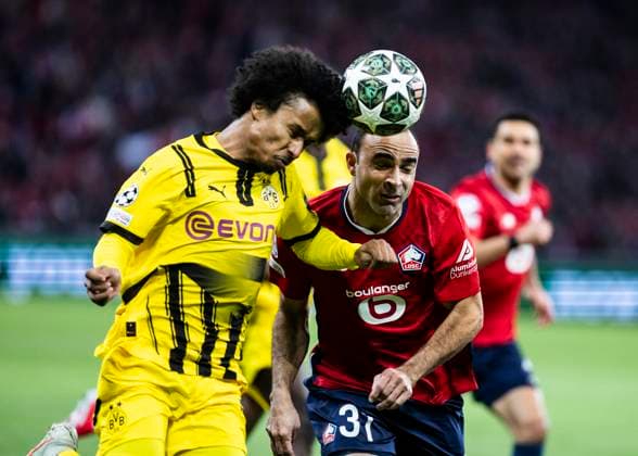 Lille, Stade Pierre Mauroy, 12.03.2025: Karim Adeyemi of Dortmund challenge Ismaily of Lille during the match of the Championsleague Round 16 between Lille OSC v. Borussia Dortmund.