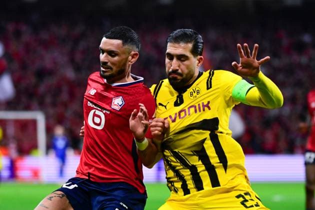 FOOTBALL : Lille vs Borussia Dortmund - Ligue des Champions - 12 03 2025 Remy CABELLA ( 10 - Lille ) and Emre Can ( 23 - Borussia Dortmund ) during UEFA Champions League match between Lille OSC and Borussia Dortmund at Stade Pierre Mauroy on March 12, 2025 in Lille, France. ( Photo by Dante Badano PsnewZ ) - LilleFrance  Copyright: xDantexBadanox