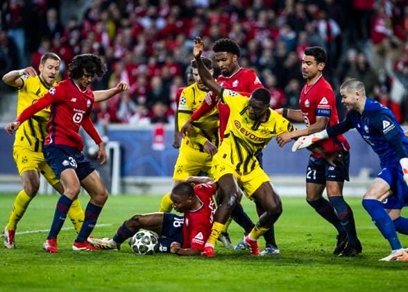 Lille, Stade Pierre Mauroy, 12.03.2025: Bafode Diakite of Lille challenges Serhou Guirassy of Dortmund during the match of the Championsleague Round 16 between Lille OSC v. Borussia Dortmund.