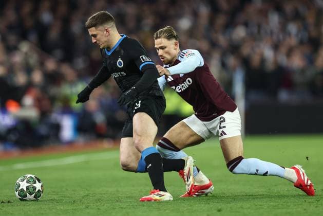 Club s Christos Tzolis and Aston Villa s Matty Cash fight for the ball during a game between English club Aston Villa and Belgian soccer Club Brugge KV, Wednesday 12 March 2025 in Birmingham, United Kingdom, the second leg of the 1 8 finals of the UEFA Champions League knockout phase. BRUNOxFAHY  x114811431x