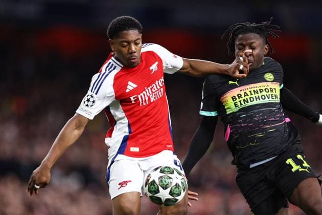 Arsenal v PSV Eindhoven 12 March 2025, London - UEFA Champions League - Round of 16 - Second Leg - Arsenal v PSV Eindhoven - Myles Lewis-Skelly of Arsenal and Johan Bakayoko of PSV Eindhoven - Photo: Jacques Feeney Offside. London UK Copyright: xJacquesxFeeneyx xOffsidexOffside