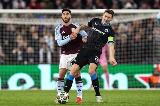 Aston Villa s Marco Asensio and Club s Hans Vanaken fight for the ball during a game between English club Aston Villa and Belgian soccer Club Brugge KV, Wednesday 12 March 2025 in Birmingham, United Kingdom, the second leg of the 1 8 finals of the UEFA Champions League knockout phase. BRUNOxFAHY  x114818678x