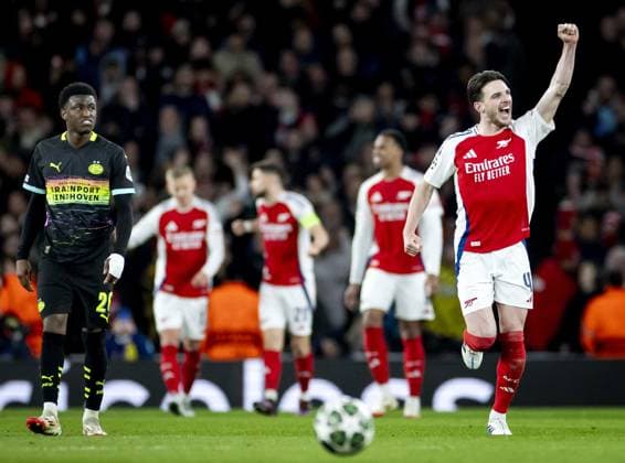 LONDON - (l-r) Isaac Babadi of PSV Eindhoven balks, Declan Rice of Arsenal FC celebrates the 2-1 during the UEFA Champions league match between Arsenal FC and PSV Eindhoven at Emirates Stadium on March 12, 2025 in London, England. ANP KOEN VAN WEEL UEFA Champions League 2024 25 Round of 16 Second Leg 2024 25 xVIxANPxSportx xxANPxIVx 522227261 originalFilename: 522227261.jpg