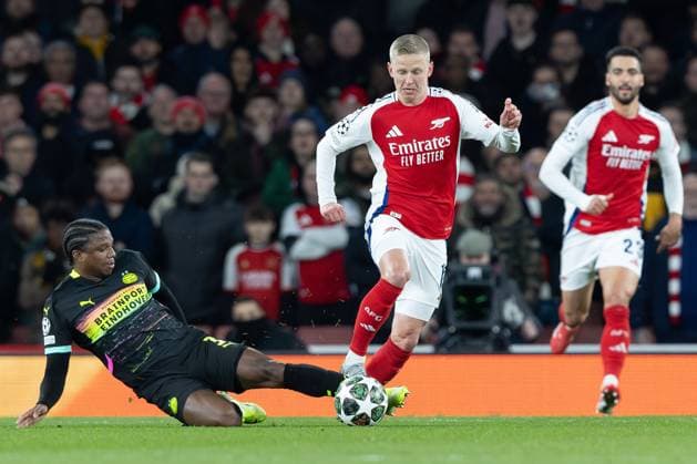 12th March 2025; Emirates Stadium, London, England; UEFA Champions League Last 16, Second Leg Football, Arsenal versus PSV Eindhoven; Johan Bakayoko of PSV Eindhoven tackles Oleksandr Zinchenko of Arsenal  ActionPlus12759461 IanxStephen