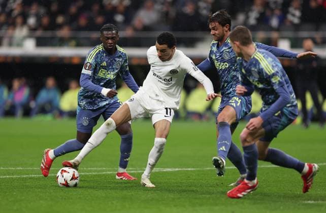13.03.2025, Fussball UEFA Europa League, Eintracht Frankfurt - Ajax AFC Amsterdam, emonline, emspor, v.l., Jorthy Mokio (Ajax Amsterdam), Hugo Ekitike (Eintracht Frankfurt), Daniele Rugani (Ajax Amsterdam) DFL DFB REGULATIONS PROHIBIT ANY USE OF PHOTOGRAPHS AS IMAGE SEQUENCES AND OR QUASI-VIDEO. xdcx Copyright: HMBxMedia Claus