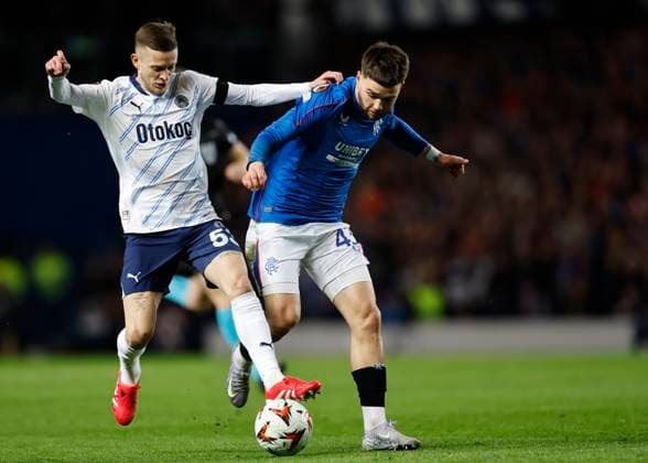 Rangers v Fenerbahce S.K. UEFA Europa League Sebastian Szymanski of Fenerbahe S.K. (left) competes for the ball with Nicolas Raskin of Rangers during the UEFA Europa League Round of 16 Second Leg match at Ibrox Stadium, Glasgow UK Newspapers OUT Copyright: xFredxPalmerx FIL-21575-0031
