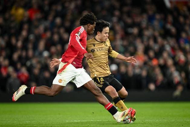 UEFA Europa League Last 16 Manchester United, ManU v Real Sociedad Takefusa Kubo of Real Sociedad is tackled by Patrick Dorgu of Manchester United during the UEFA Europa League Last 16 match Manchester United vs Real Sociedad at Old Trafford, Manchester, United Kingdom, 13th March 2025 (Photo by Craig Thomas News Images) Manchester Old Trafford Greater Manchester United Kingdom Copyright: xCraigxThomas NewsxImagesx