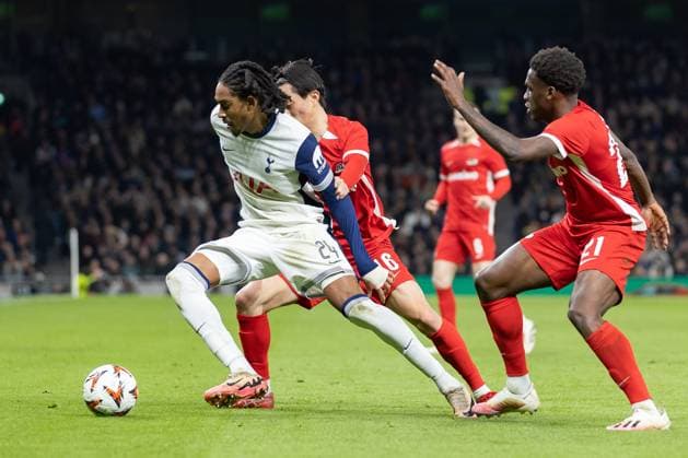 Tottenham Hotspur v AZ Alkmaar, Europa League, Round of 16, Leg 2 of 2, Football, Tottenham Hotspur Stadium, Tottenham, London, UK - 13 Mar 2025 Djed Spence of Tottenham Hotspur holds off Seiya Maikuma of AZ Alkmaar Tottenham Tottenham Hotspur Stadium London GBR, UK NEWSPAPERS OUT Copyright: xEllixBirchx