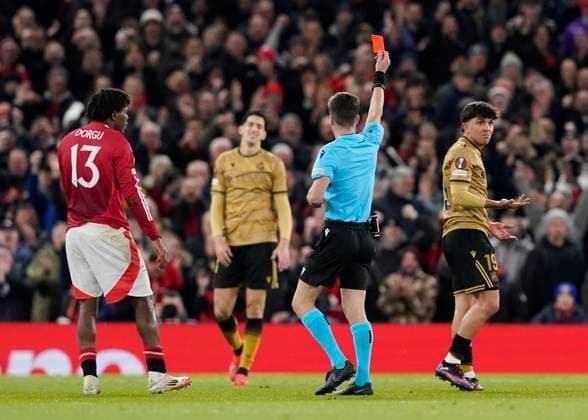 Manchester, England, 13th March 2025. Jon Mikel Aramburu (r) of Real Sociedad is sent off during the UEFA Europa League match Manchester United, ManU v Real Sociedad at Old Trafford, Manchester. Picture credit should read: Andrew Yates Sportimage EDITORIAL USE ONLY. No use with unauthorised audio, video, data, fixture lists, club league logos or live services. Online in-match use limited to 120 images, no video emulation. No use in betting, games or single club league player publications. SPI_060_AY_MANU_SOCIEDAD SPI-3744-0063