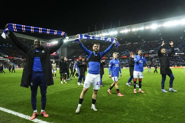 Nicolas Raskin of Rangers holds a scarf at full-time Rangers v Fenerbahce, UEFA Europa League, Round of 16, Second Leg, Football, Ibrox Stadium, Glasgow, Scotland, UK - 13 Mar 2025 EDITORIAL USE ONLY No use with unauthorised audio, video, data, fixture lists, club league logos or live services. Online in-match use limited to 120 images, no video emulation. No use in betting, games or single club league player publications.  Copyright: xStuartxWallace Shutterstockx 15188226eg