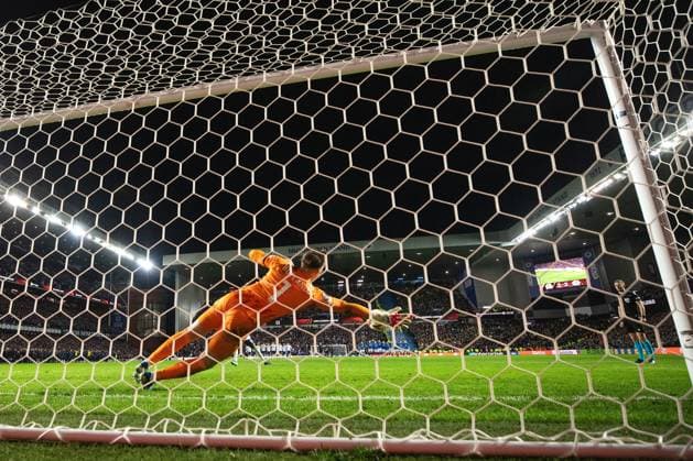 Rangers goalkeeper Jack Butland saves Fred of Fenerbahce s penalty during the Europa League last 16 match at Ibrox Stadium, Glasgow. Rangers v Fenerbahce, UEFA Europa League, Round of 16, Second Leg, Football, Ibrox Stadium, Glasgow, Scotland, UK - 13 Mar 2025 EDITORIAL USE ONLY No use with unauthorised audio, video, data, fixture lists, club league logos or live services. Online in-match use limited to 120 images, no video emulation. No use in betting, games or single club league player publications.  Copyright: xO Rourke RangersxFC Shutterstockx 15196580bl