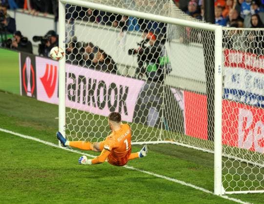 Jack Butland of Rangers saves the penalty from Dusan Tadic of Fenerbahce in the penalty shoot out during the UEFA Europa League round of 16 match at Ibrox Stadium, Glasgow. Rangers v Fenerbahce, UEFA Europa League, Round of 16, Second Leg, Football, Ibrox Stadium, Glasgow, Scotland, UK - 13 Mar 2025 EDITORIAL USE ONLY No use with unauthorised audio, video, data, fixture lists, club league logos or live services. Online in-match use limited to 120 images, no video emulation. No use in betting, games or single club league player publications.  Copyright: xRangersxFC Shutterstockx 15196581i