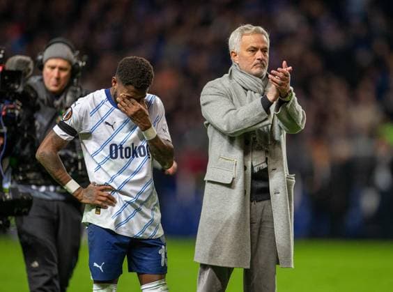 13th March 2025; Ibrox Stadium, Glasgow, Scotland; UEFA Europa League Last 16 Second Leg Football, Rangers versus Fenerbahce; Fenerbahce Head Coach Jose Mourinho applauds the fans as Fred of Fenerbahce covers his eyes  ActionPlus12760185 VagelisxGeorgariou