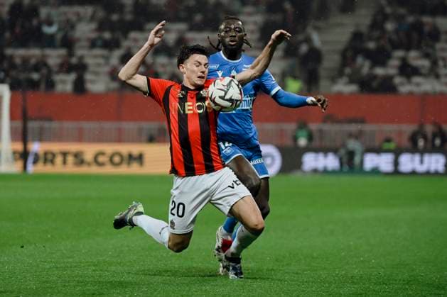 FOOTBALL : OGC Nice vs AJ Auxerre - ligue 1 - 14 3 25 Nice™s defender 20 Tom Louchet and Auxerre s defender 14 Gideon Mensah during the during the French L1 football match between OGC Nice and AJ Auxerre at Allianz Riviera Stadium of Nice, south France, on March 14, 2025. NICEFrance  Copyright: xfredxDIDES psnewzx