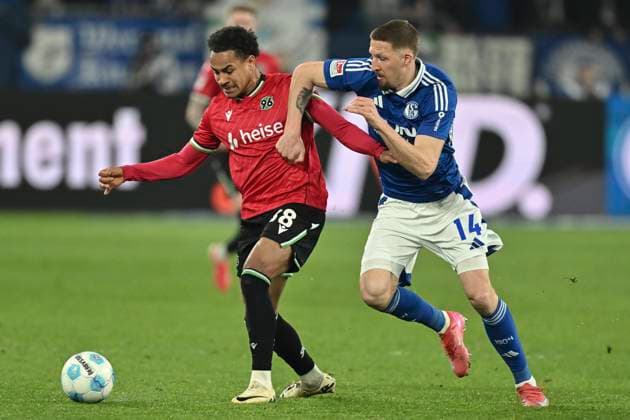 RECORD DATE NOT STATED v. li. im Zweikampf Monju Momuluh (Hannover 38) Janik Bachmann (Schalke 14) 14.03.2025 Fussball FC Schalke 04 vs Hannover 96, Veltins-Arena, Gelsenkirchen, DFB DFL REGULATIONS PROHIBIT ANY USE OF PHOTOGRAPHS AS IMAGE SEQUENCES AND OR QUASI-VIDEO