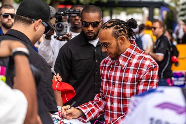 March 15, 2025, Melbourne, Victoria, Australia: Scuderia Ferrari HP driver LEWIS HAMILTON of the United Kingdom signs autographs in the paddock on Saturday at the Formula 1 Louis Vuitton Australian Grand Prix 2025 on March 15, 2025 in Melbourne, Australia. Melbourne Australia - ZUMAf186 20250315_zsp_f186_029 Copyright: xJamesxForresterx