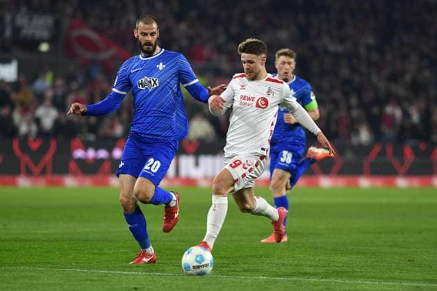 Aleksandar Vukotic (SV Darmstadt 98) und Jan Thielmann (1. FC Koeln) im Zweikampf waehrend des Spiels der 2. Bundesliga zwischen 1. FC Köln und SV Darmstadt 98 im RheinEnergieStadion am 15. March 2025 in Köln, Deutschland. (Foto von Ralf Treese DeFodi Images) +++ Aleksandar Vukotic (SV Darmstadt 98) und Jan Thielmann (1. FC Koeln) battle for the ball during the 2. Bundesliga match between 1. FC Köln and SV Darmstadt 98 at RheinEnergieStadion on March 15, 2025 in Cologne, Germany. (Photo by Ralf Treese DeFodi Images) DFB DFL REGULATIONS PROHIBIT ANY USE OF PHOTOGRAPHS AS IMAGE SEQUENCES AND OR QUASI-VIDEO. (Photo by Ralf Treese DeFodi Images)