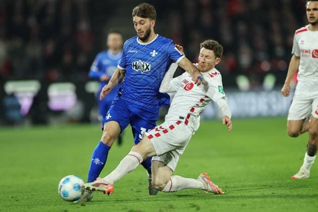 GER, 2.FBL, 1. FC Koeln vs. SV Darmstadt 98 15.03.2025, Rheinenergie Stadion, Koeln, GER, 2.FBL, 1. FC Koeln vs. SV Darmstadt 98, im Bild: Killian Corredor (Darmstadt 98 34), im Zweikampf gegen Florian Kainz (FC Koeln 11),