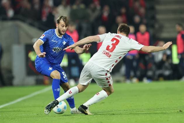 GER, 2.FBL, 1. FC Koeln vs. SV Darmstadt 98 15.03.2025, Rheinenergie Stadion, Koeln, GER, 2.FBL, 1. FC Koeln vs. SV Darmstadt 98, im Bild: Killian Corredor (Darmstadt 98 34), im Zweikampf gegen Dominique Heintz (FC Koeln 3),