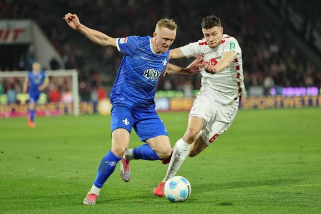 GER, 2.FBL, 1. FC Koeln vs. SV Darmstadt 98 15.03.2025, Rheinenergie Stadion, Koeln, GER, 2.FBL, 1. FC Koeln vs. SV Darmstadt 98, im Bild: Eric Martel (FC Koeln 6), im Zweikampf gegen Isac Lidberg (Darmstadt 98 7),