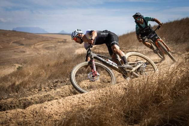 Sport Bilder des Tages Swiss riders Filippo Colombo and Nino Schurter on the course of the opening prologue of the seven-day Cape Epic pairs mountain bike stage race in South Africa, March 16, 2025. (CTKxPhoto MichalxCerveny) CTKPhotoF202503160023101  CTKPhotoF202503160023101
