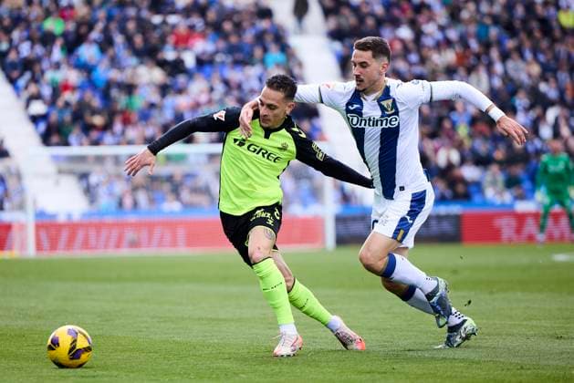 Antony (Real Betis) and Javier Hernandez (CD Leganes) battle for the ball during the LaLiga match between CD LeganÃ s and Real Betis at Butarque on March 16, 2025 in LeganÃ s, Spain. (Photo by Manu Reino DeFodi Images)