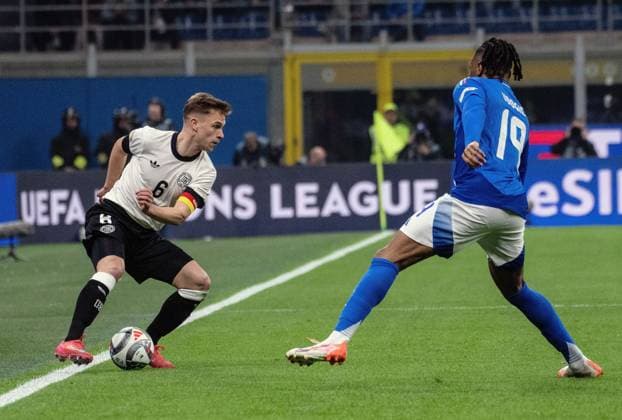 20.03.2025, xcmcx, Fussball UEFA Nations League, Italien - Deutschland v.l. Joshua Kimmich (Deutsche Fussball Nationalmannschaft DFB), Destiny Udogie (Italien) (DFL DFB REGULATIONS PROHIBIT ANY USE OF PHOTOGRAPHS as IMAGE SEQUENCES and or QUASI-VIDEO) Mailand