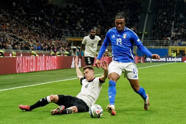 Milan, Italy, 20th March 2025: Joshua Kimmich (6 Germany) and Destiny Udogie (19 Italy) battle for the ball (duel) during the UEFA Nations League Quarterfinal football match between Italy and Germany at Stadio San Siro in Milan, Italy. (Daniela Porcelli SPP) Copyright: xDanielaxPorcellix xSPPx spp-en-DaPoSp-20250320-DP202636
