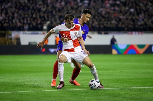 Croatia v France - UEFA Nations League Quarterfinal Leg One SPLIT, CROATIA - MARCH 20: Ante Budimir of Croatia is challenged by William Saliba of France during the UEFA Nations League quarterfinal leg one match between Croatia and France at Stadion Poljud on March 20, 2025 in Split, Croatia.  SimexZelic PIXSELL