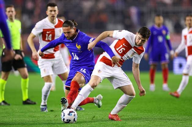 Croatia v France - UEFA Nations League Quarterfinal Leg One SPLIT, CROATIA - MARCH 20: Martin Baturina of Croatia is challenged by Adrien Rabiot of France during the UEFA Nations League quarterfinal leg one match between Croatia and France at Stadion Poljud on March 20, 2025 in Split, Croatia.  IgorxKralj PIXSELL