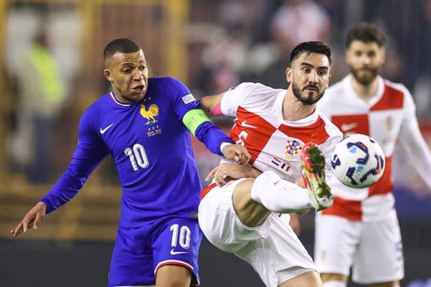 Croatia v France - UEFA Nations League Quarterfinal Leg One SPLIT, CROATIA - MARCH 20: Josip Sutalo of Croatia is challenged by Kylian Mbappe of France during the UEFA Nations League quarterfinal leg one match between Croatia and France at Stadion Poljud on March 20, 2025 in Split, Croatia.  IgorxKralj PIXSELL