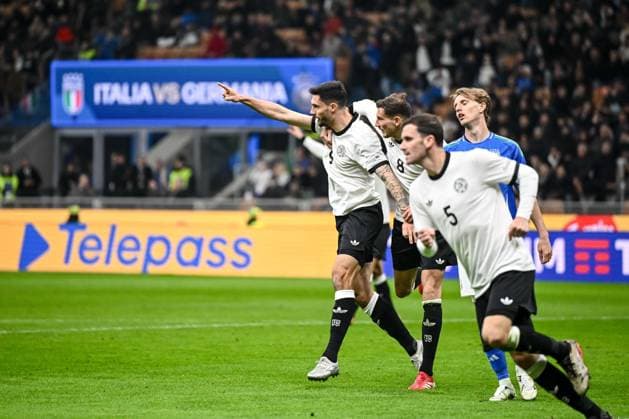 Tim Kleindienst (Germany), Leon Goretzka (Germany) und Pascal Gross (Germany) celebrates after scoring his team s first goal with teammates during the UEFA Nations League quarterfinal leg one match between Italy and Germany at Stadio San Siro on March 20, 2025 in Milan, Italy. (Photo by Harry Langer DeFodi Images)
