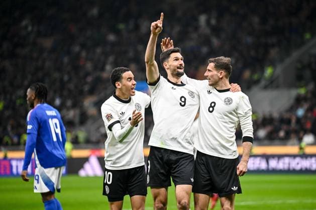 Jamal Musiala (Germany), Leon Goretzka (Germany) und Tim Kleindienst (Germany) celebrates after scoring his team s first goal with teammates during the UEFA Nations League quarterfinal leg one match between Italy and Germany at Stadio San Siro on March 20, 2025 in Milan, Italy. (Photo by Harry Langer DeFodi Images)