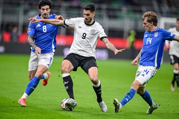 Sandro Tonali (Italy), Tim Kleindienst (Germany) und Nicolo Rovella (Italy) battle for the ball during the UEFA Nations League quarterfinal leg one match between Italy and Germany at Stadio San Siro on March 20, 2025 in Milan, Italy. (Photo by Harry Langer DeFodi Images)