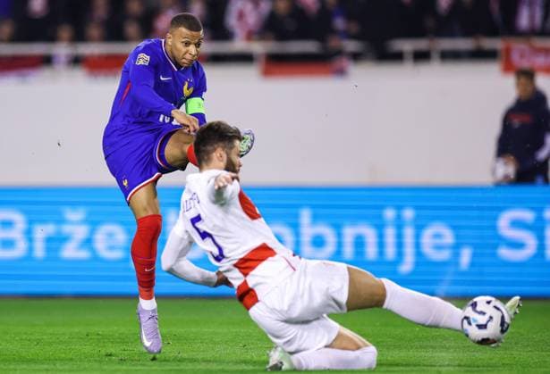 (250321) -- SPLIT, March 21, 2025 -- Kylian Mbappe (L) of France shoots during the UEFA Nations League quarterfinal 1st leg football match between Croatia and France in Split, Croatia, on March 20, 2025. (Photo by Zvonimir Barisin PIXSELL via Xinhua) (SP)CROATIA-SPLIT-FOOTBALL-UEFA NATIONS LEAGUE-CRO VS FRA LixXuejun 