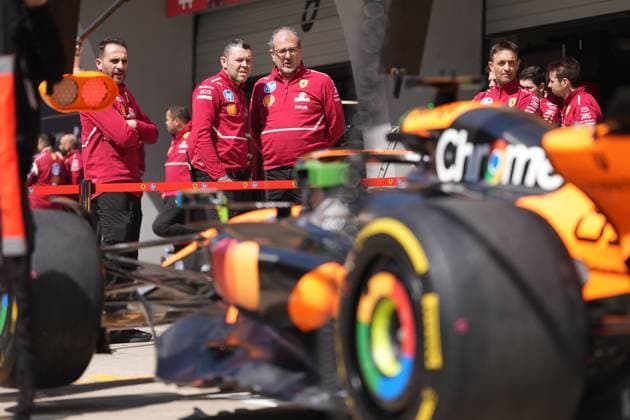 SHANGHAI, CHINA - MARCH 21: Ferrari team staff look at McLaren racing car during the practice session of the Formula One Chinese Grand Prix at the Shanghai International Circuit on March 21, 2025 in Shanghai, China.  Copyright: xChinaxNewsxServicex 111556346999