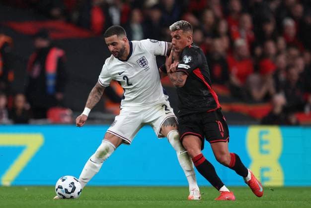 Kyle Walker of England with Myrto Uzuni of Albania England v Albania - UEFA World Cup Qualifiers - Group K. Football. Wembley Stadium, London. UK. 3 MAR 2025 Editorial use only  Copyright: xJASONPIX Shutterstockx 15216523ar