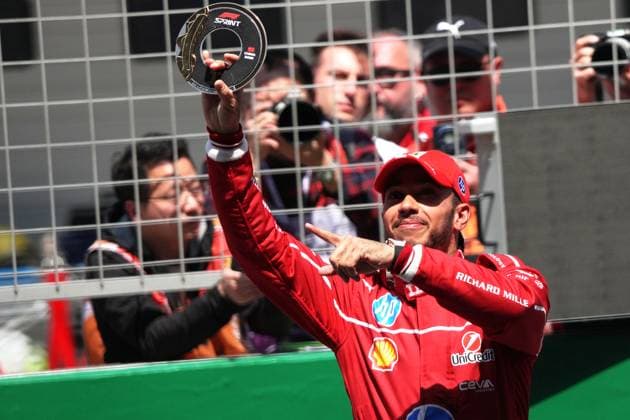 SHANGHAI, CHINA - MARCH 22: Ferrari driver Lewis Hamilton of Britain holds up the trophy to celebrate winning the sprint race of the Formula One Chinese Grand Prix at the Shanghai International Circuit on March 22, 2025 in Shanghai, China.  Copyright: xChinaxNewsxServicex 111556563312