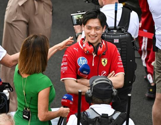 (250322) -- SHANGHAI, March 22, 2025 -- Ferrari s reserve driver Zhou Guanyu (R) shows up before the sprint race of the Formula 1 Chinese Grand Prix at the Shanghai International Circuit in east China s Shanghai, March 22, 2025. ) (SP)CHINA-SHANGHAI-FORMULA 1-SPRINT(CN) XiaxYifang 