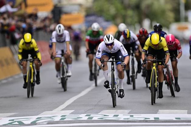 Dutch Lorena Wiebes of SD Worx-Protime (C) celebrates as she crosses the finish line, before Dutch Marianne Vos of Team Visma-Lease a Bike (R), to win the sprint at the finish of the Milano-Sanremo one day cycling race for men, 289km from Milan to Sanremo, Italy, Saturday 22 March 2025. DIRKxWAEM  x115406688x