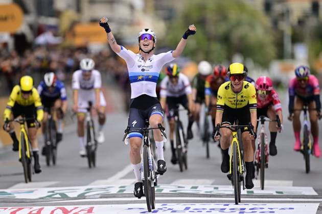 Dutch Lorena Wiebes of SD Worx-Protime (C) celebrates as she crosses the finish line, before Dutch Marianne Vos of Team Visma-Lease a Bike (R), to win the sprint at the finish of the Milano-Sanremo one day cycling race for men, 289km from Milan to Sanremo, Italy, Saturday 22 March 2025. DIRKxWAEM  x115407084x