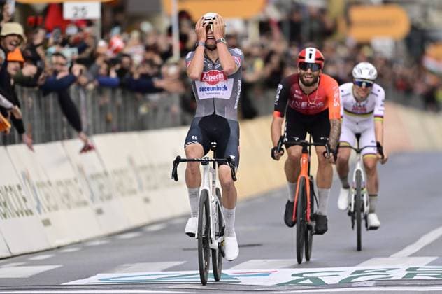 Dutch Mathieu van der Poel of Alpecin-Deceuninck (L) celebrates as he wins before Italian Filippo Ganna of Ineos Grenadiers (C) and Slovenian Tadej Pogacar of UAE Team Emirates (R) the sprint at the finish of the Milano-Sanremo one day cycling race for men, 289km from Milan to Sanremo, Italy, Saturday 22 March 2025. DIRKxWAEM  x115413299x